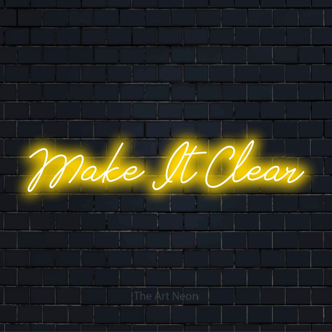 "Make It Clear" neon text design on a black brick wall