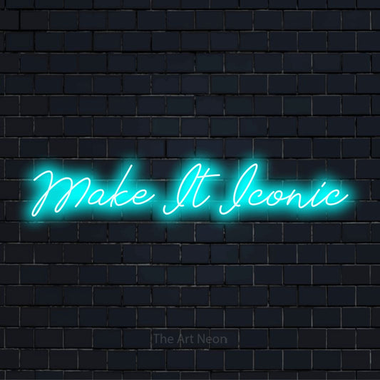 "Make It Iconic" glowing LED neon sign on a black brick wall