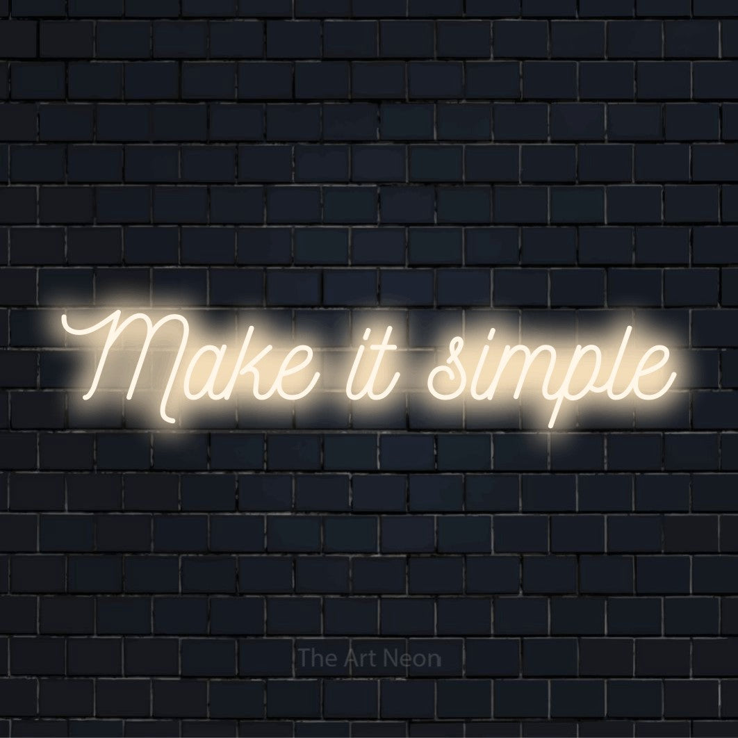 "Make It Simple" neon text design on a black brick wall