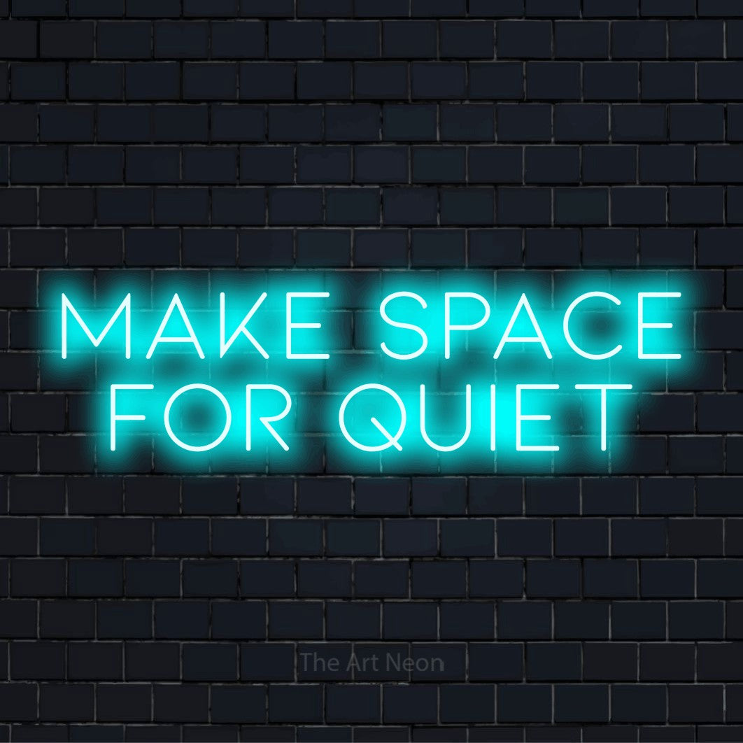 "Make Space For Quiet" text design with neon effect on a black brick wall