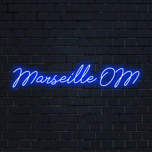 Marseille Om Neon Light with bright LED glow on dark brick wall