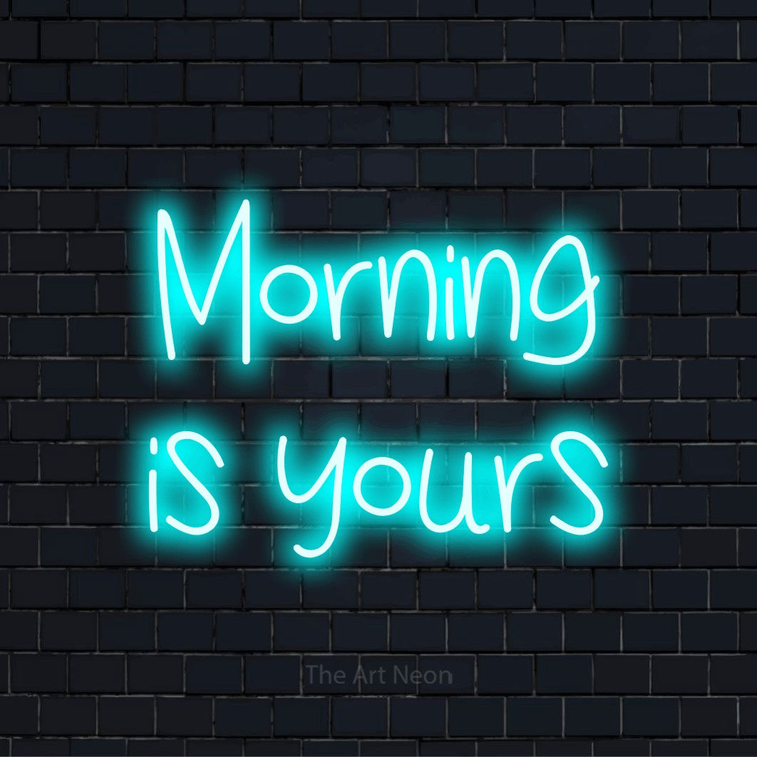 "Morning Is Yours" neon text design on a black brick wall