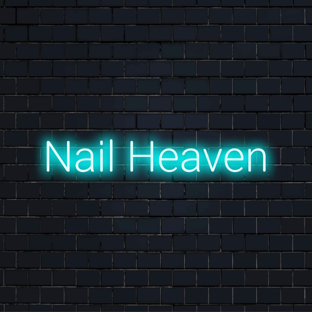 Nail Heaven Neon Sign, bright neon lettering on black brick background