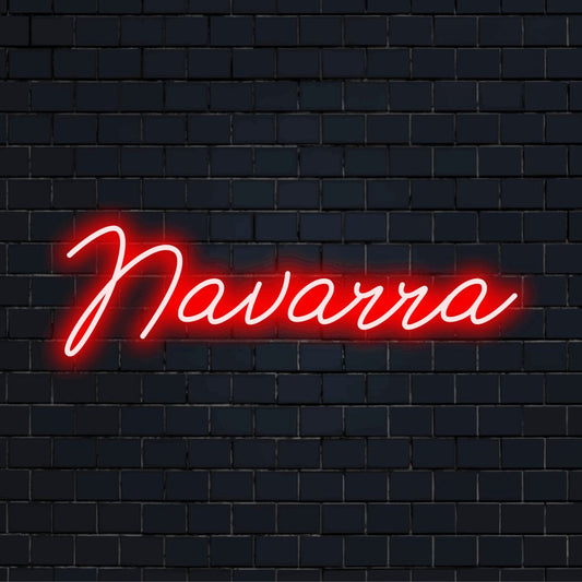 Navarra Neon Light with bright neon lettering on dark brick background