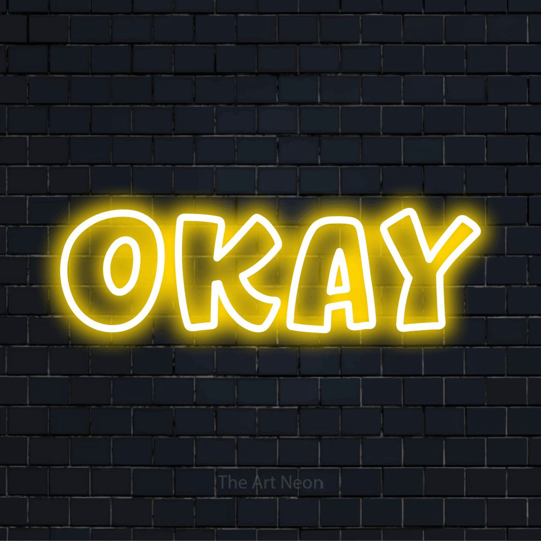 "Okay" glowing LED neon sign on a black brick wall