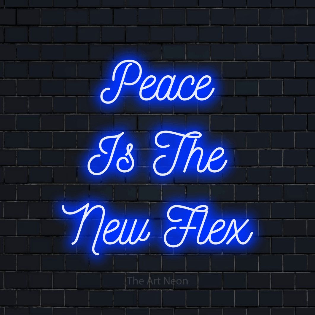"Peace Is The New Flex" script-style LED neon sign on a black brick wall