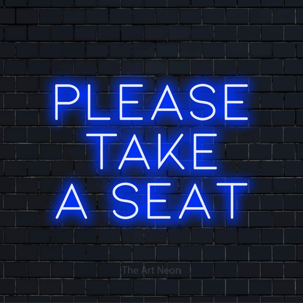 "Please Take A Seat" glowing LED neon sign on a black brick wall