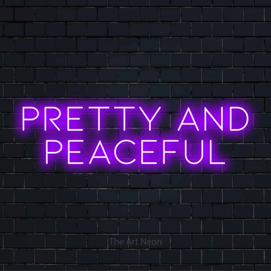 "Pretty And Peaceful" neon text design on a black brick wall