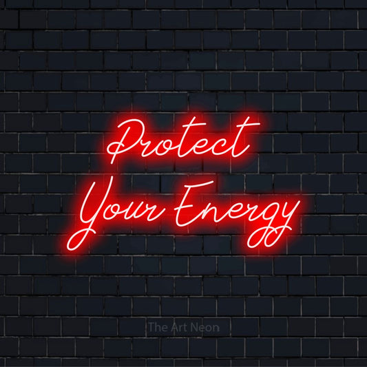 "Protect Your Energy" script-style LED neon sign on a black brick wall