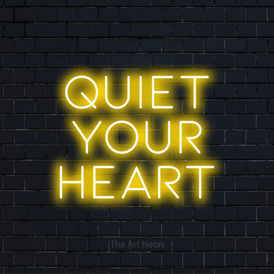 "Quiet Your Heart" glowing LED neon sign on a black brick wall