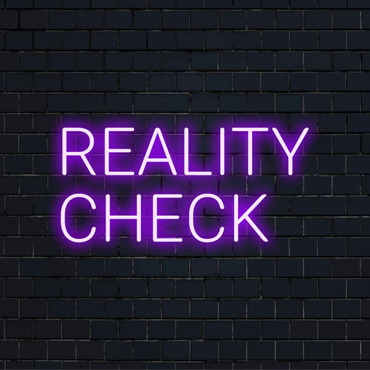 Reality Check LED Neon Sign, bright neon lettering on dark brick background
