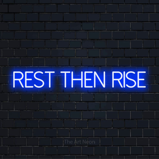 "Rest Then Rise" glowing LED neon sign on a black brick wall