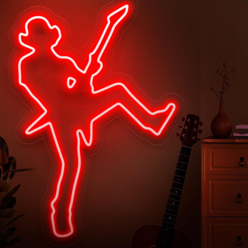 En dynamisk neonskylt med silhuetten av en rockstjärna, som fångar energin och karisman i ett livemusikframträdande.