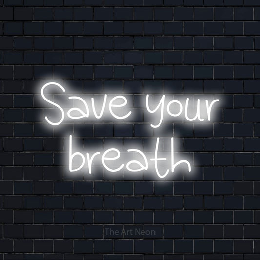"Save Your Breath" neon text design on a black brick wall
