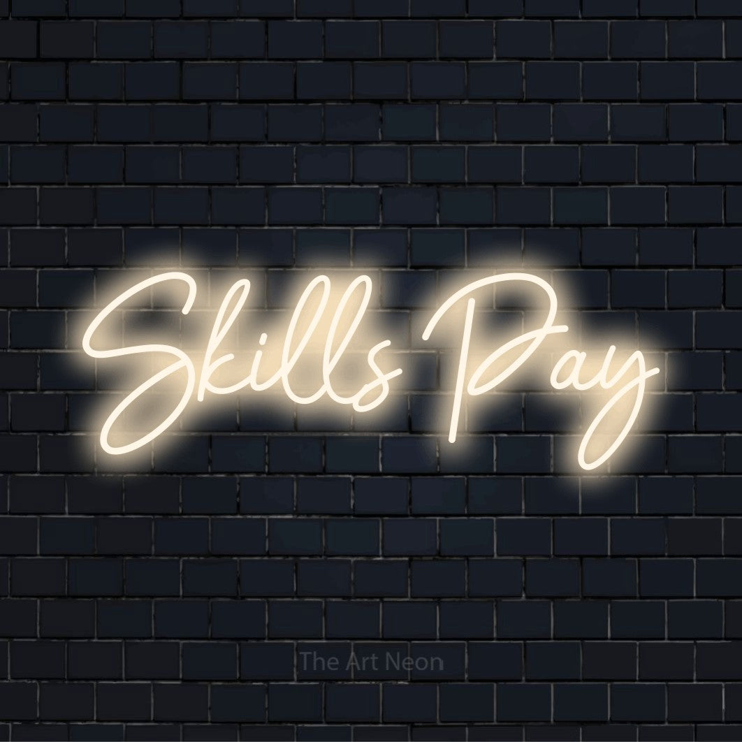 "Skills Pay" text design with neon effect on a black brick wall