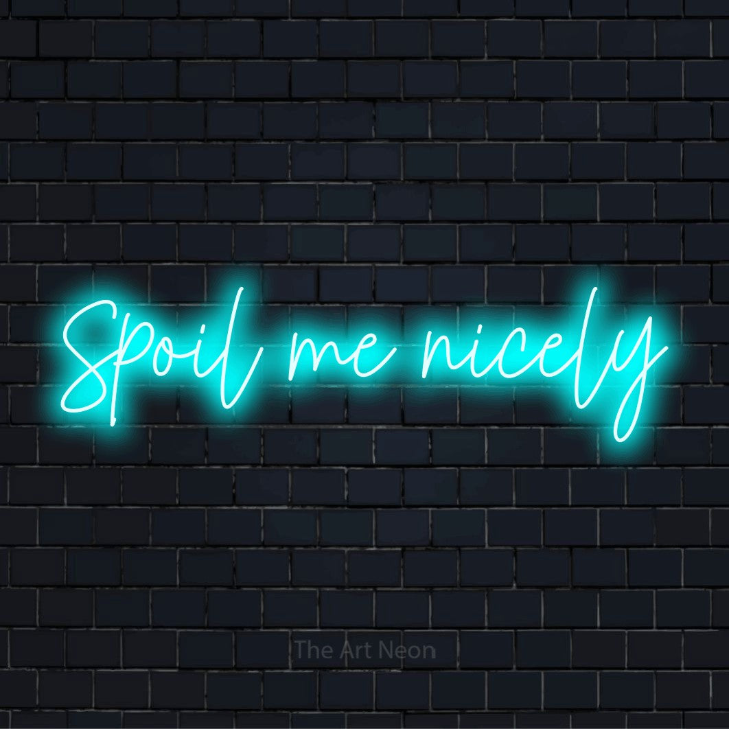 "Spoil Me Nicely" script-style LED neon sign on a black brick wall
