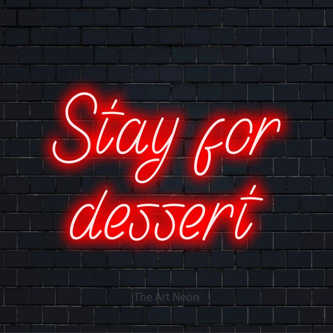 "Stay For Dessert" script-style LED neon sign on a black brick wall
