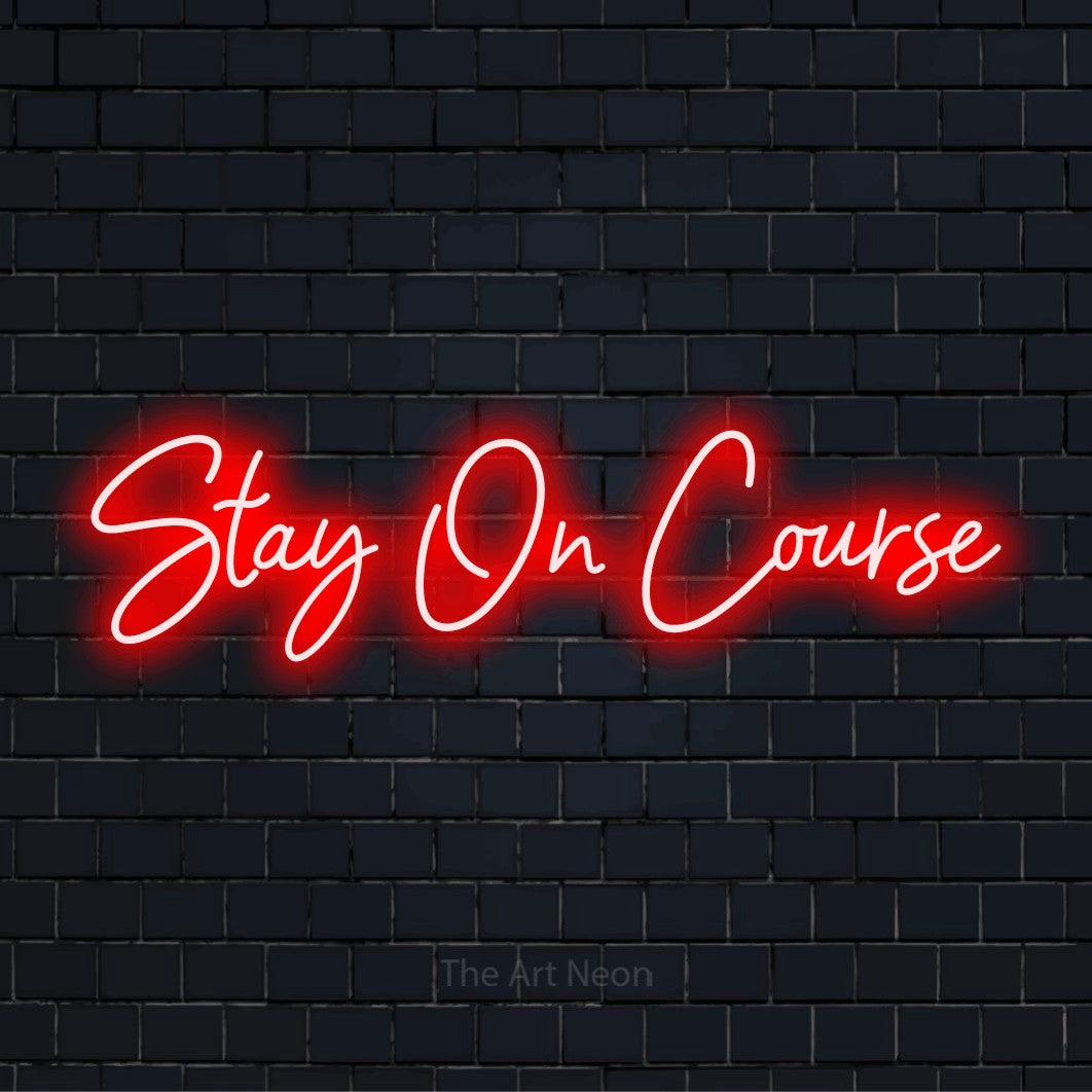"Stay On Course" glowing LED neon sign on a black brick wall