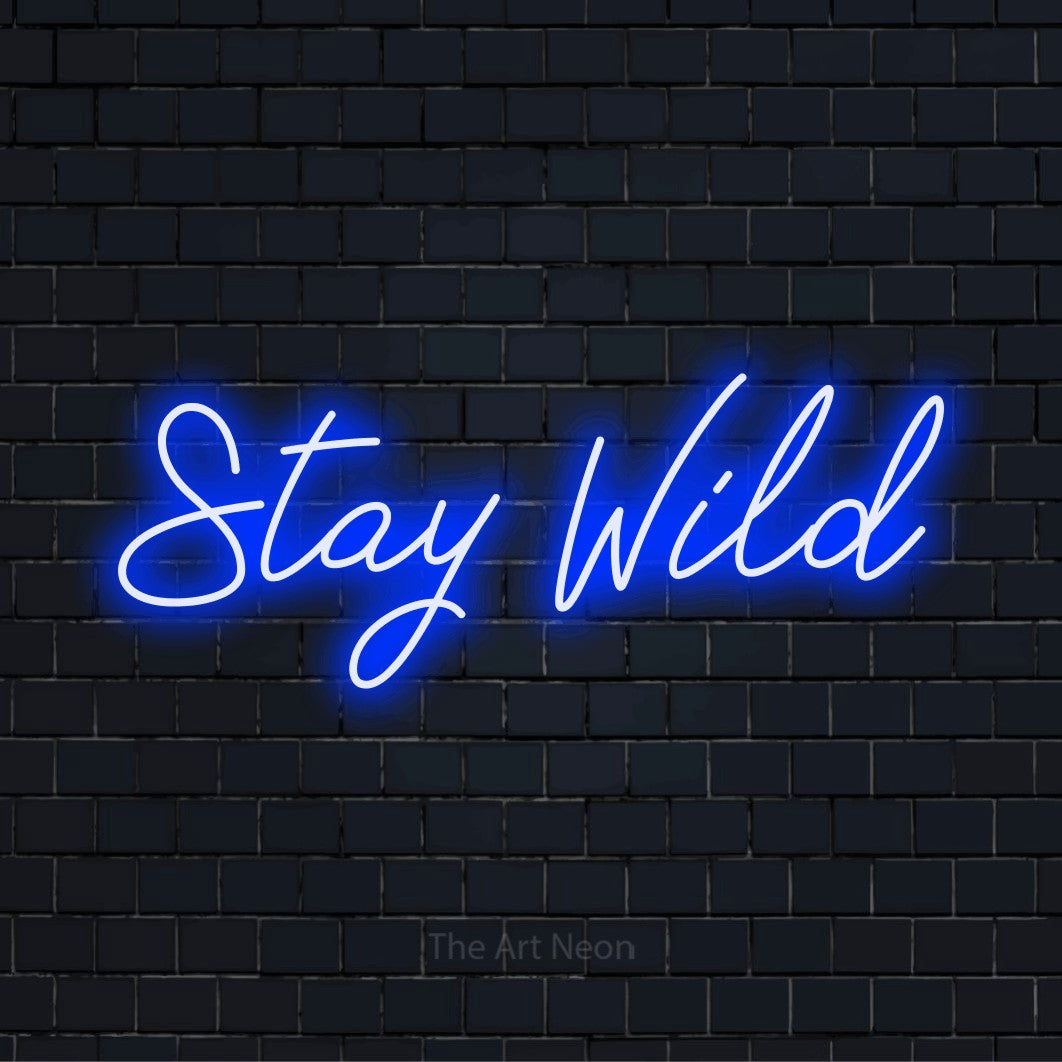 "Stay Wild" neon text design on a black brick wall