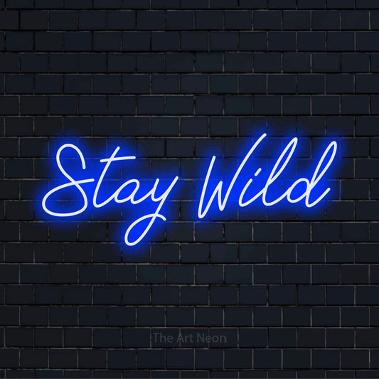 "Stay Wild" neon text design on a black brick wall