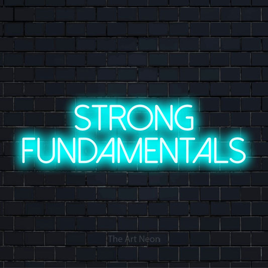 "Strong Fundamentals" glowing LED neon sign on a black brick wall