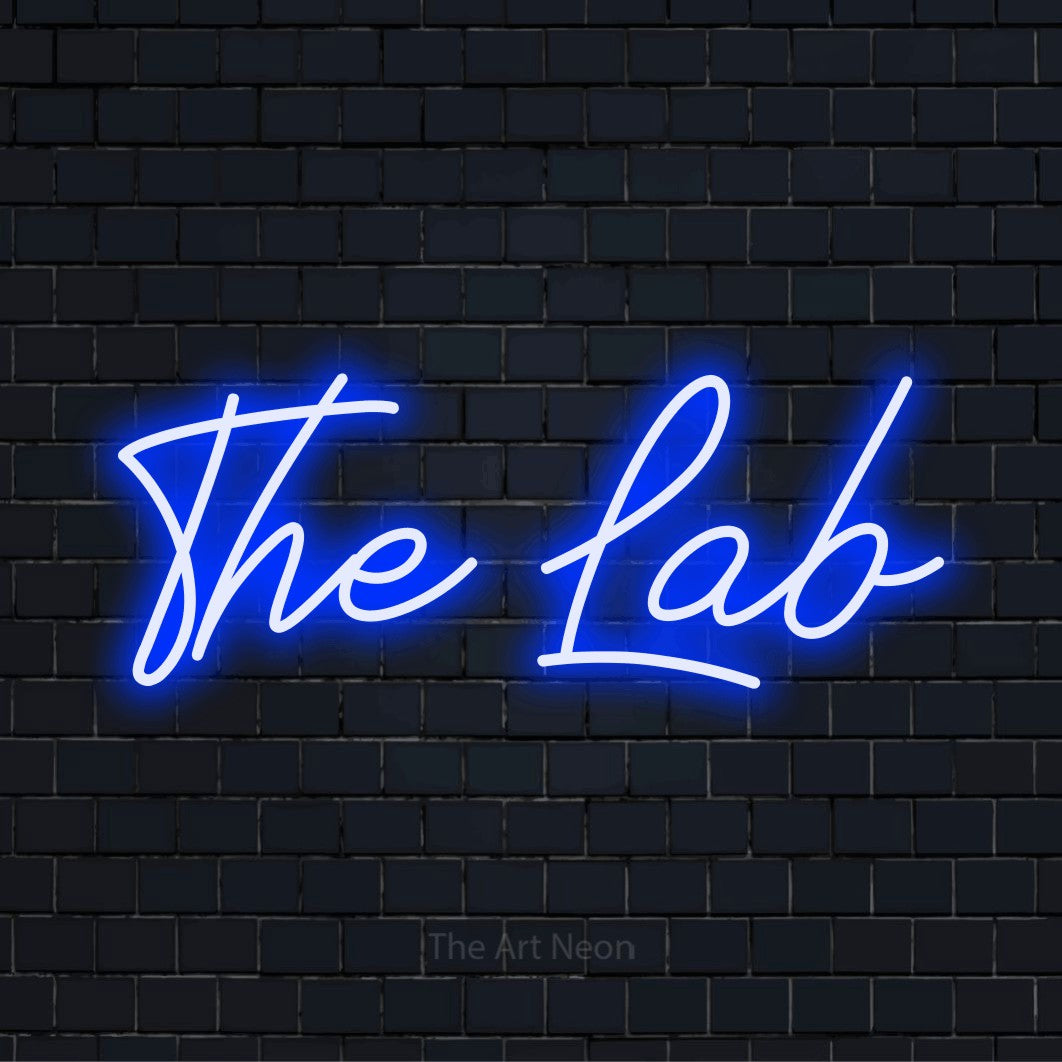 "The Lab" LED neon sign on a black brick wall