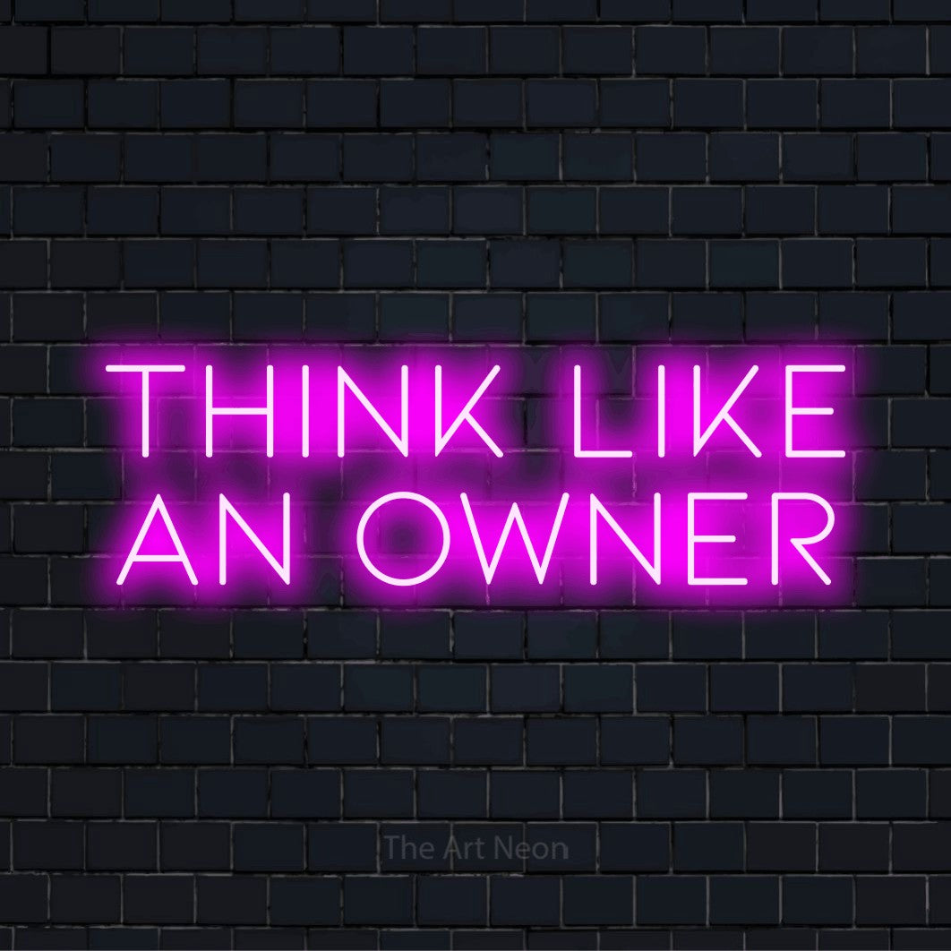 "Think Like An Owner" glowing LED neon sign on a black brick wall