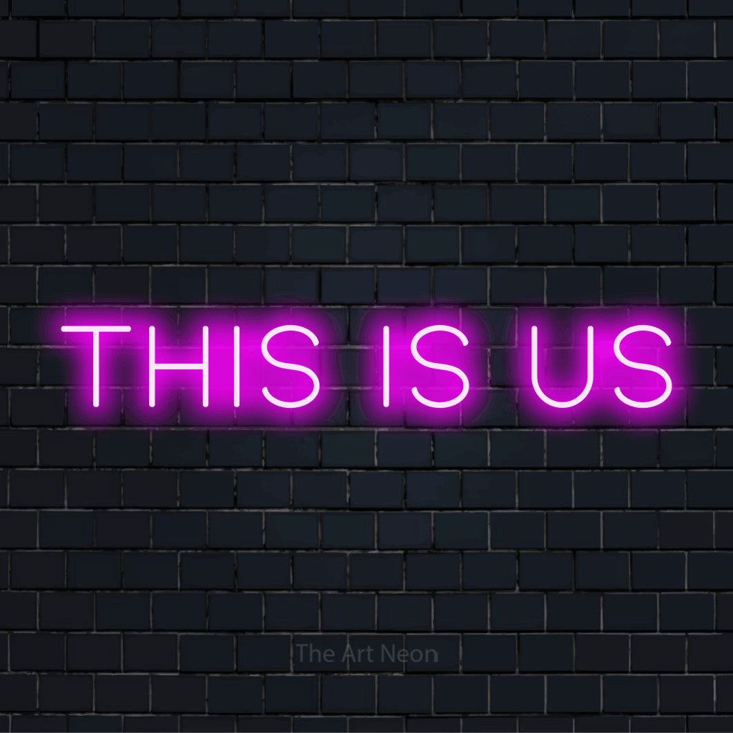 "This Is Us" text design with neon effect on a black brick wall