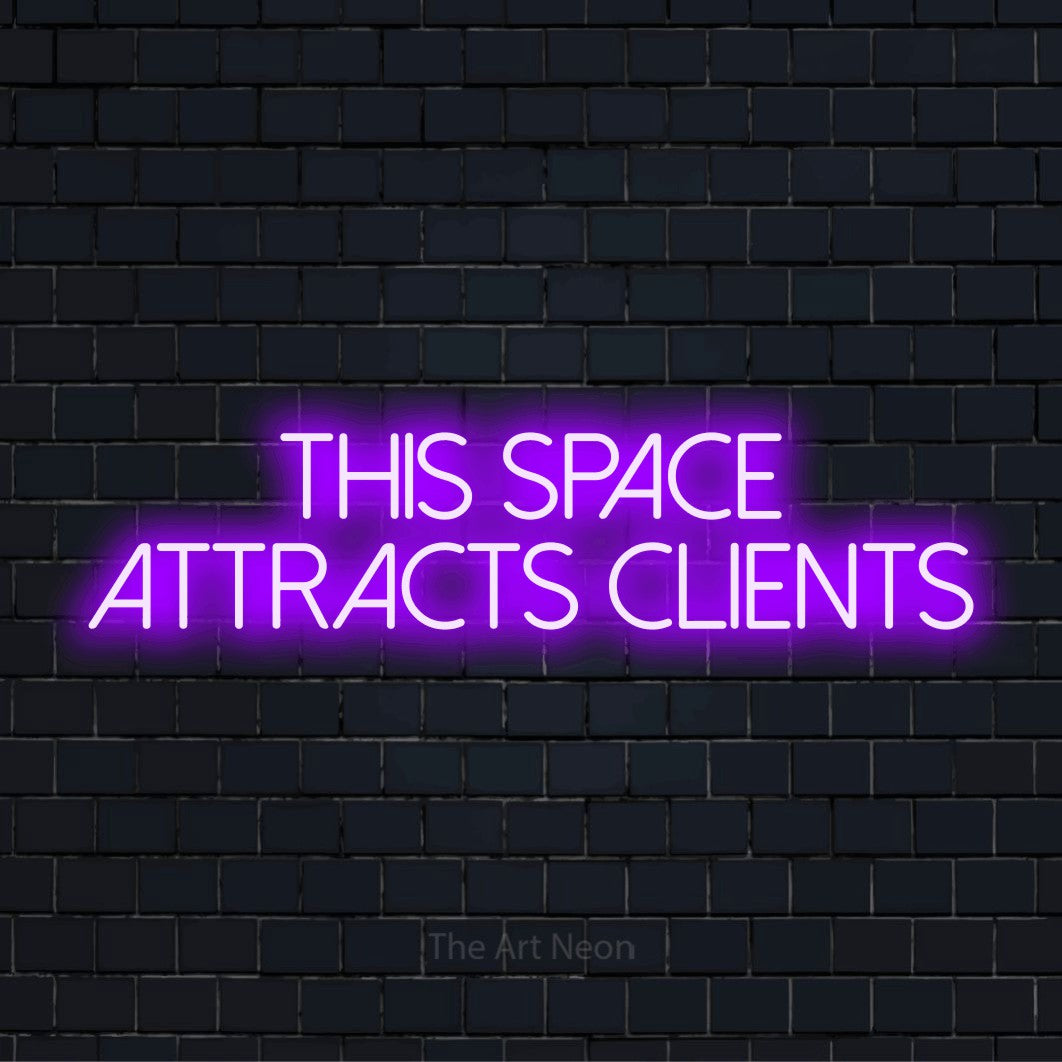 "This Space Attracts Clients" glowing LED neon sign on a black brick wall