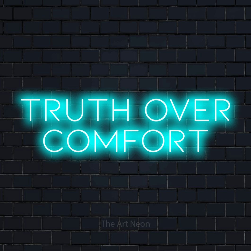 "Truth Over Comfort" text design with neon effect on a black brick wall
