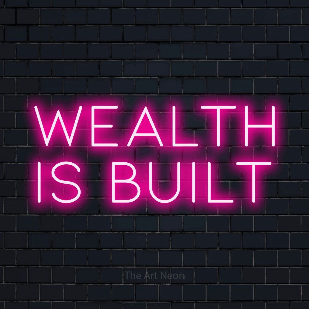 "Wealth Is Built" neon text design on a black brick wall