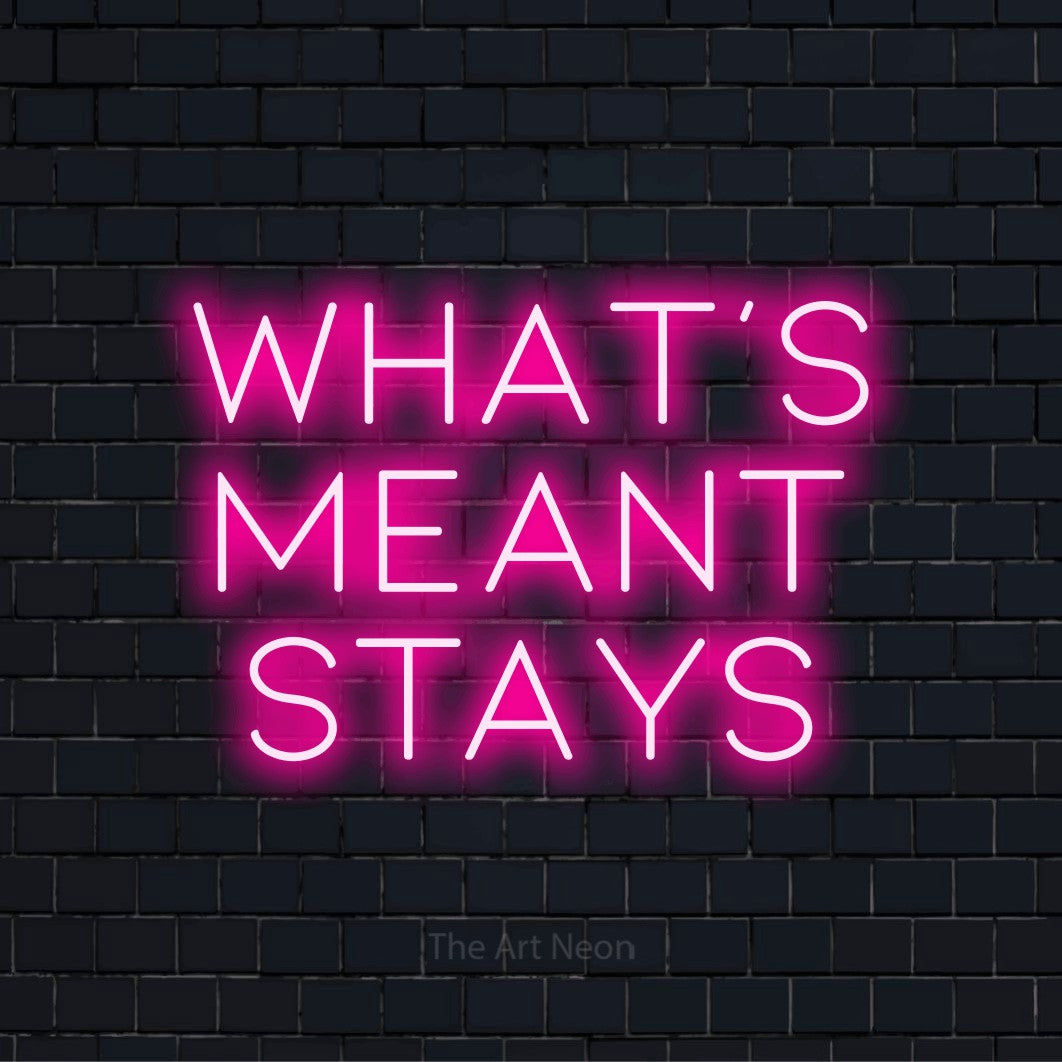 "What’s Meant Stays" LED neon sign on a black brick wall