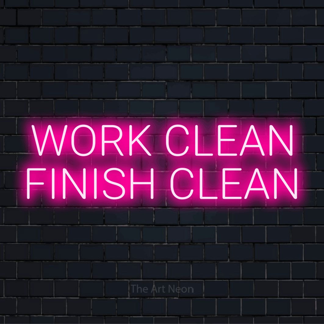 "Work Clean Finish Clean" neon text design on a black brick wall
