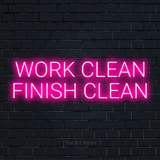 "Work Clean Finish Clean" neon text design on a black brick wall