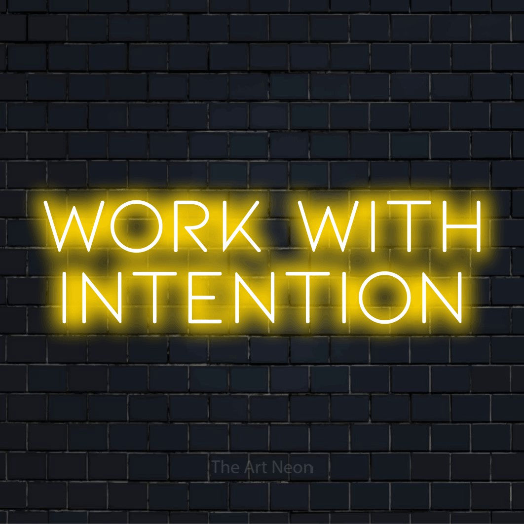 "Work With Intention" text design with neon effect on a black brick wall