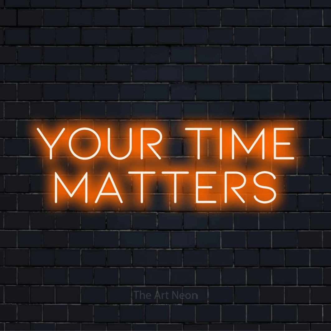 "Your Time Matters" LED neon sign on a black brick wall